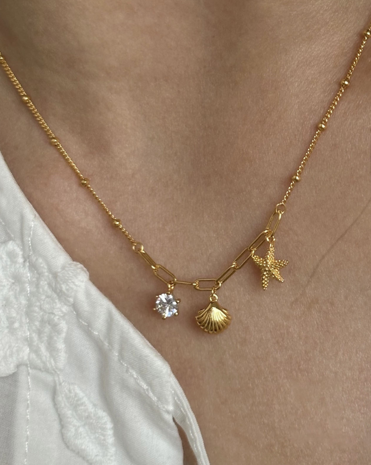 Cadena estrella con concha dorado