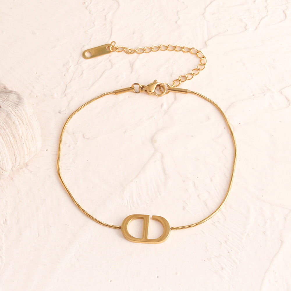 Pulsera con dije tipo boton