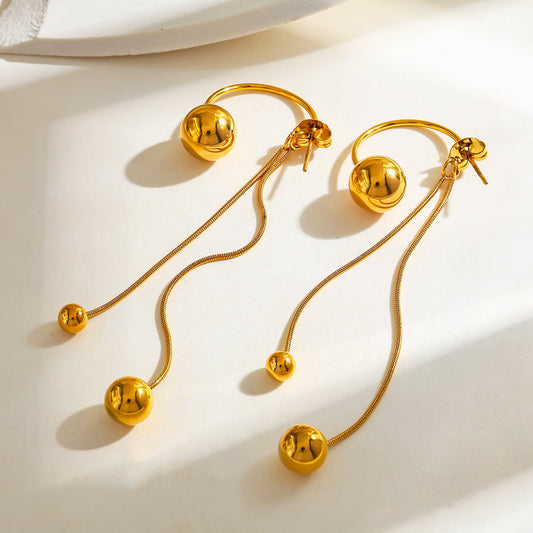 Aretes largos con círculos dorado